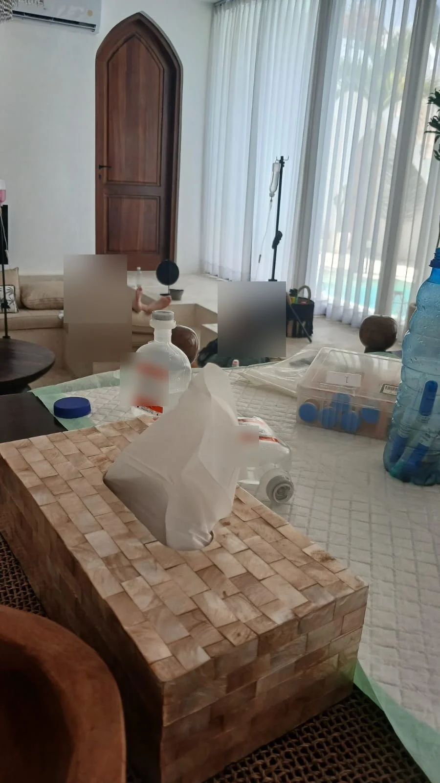 IV drip session at a Bali villa, guest faces obscured